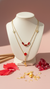 Luxury Layered Ruby Charm Necklace β Elegant Gold Statement Jewellery | DIAURA Jewels