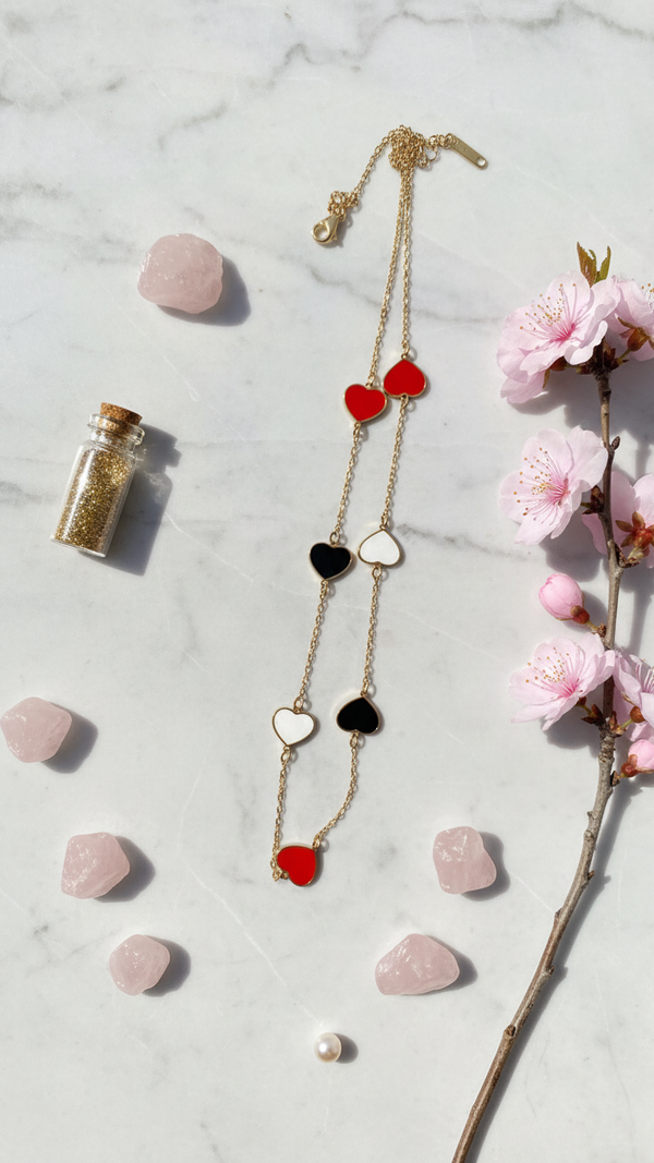 Multi heart layered necklace with red black white enamel charms by Diaura Jewels, party romantic wear